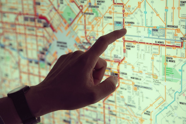 hand pointing at map